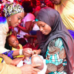 Mrs-Toyin-Saraki-administering-oral-polio-vaccine-on-a-child