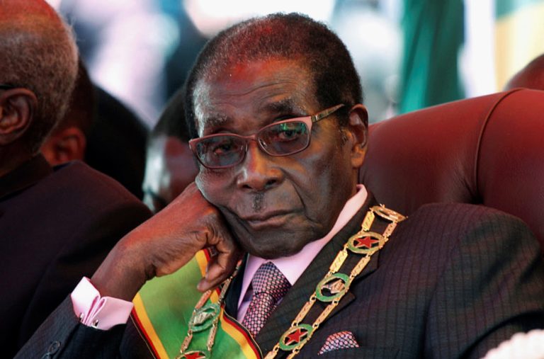 FILE PHOTO -  File photo of Zimbabwe's President Mugabe looking on during a rally marking Zimbabwe's 32nd independence anniversary celebrations in Harare