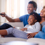 Shot of a family watching television together at home