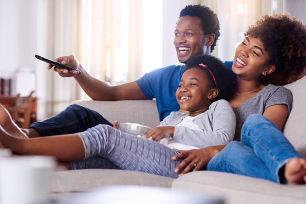 Shot of a family watching television together at home